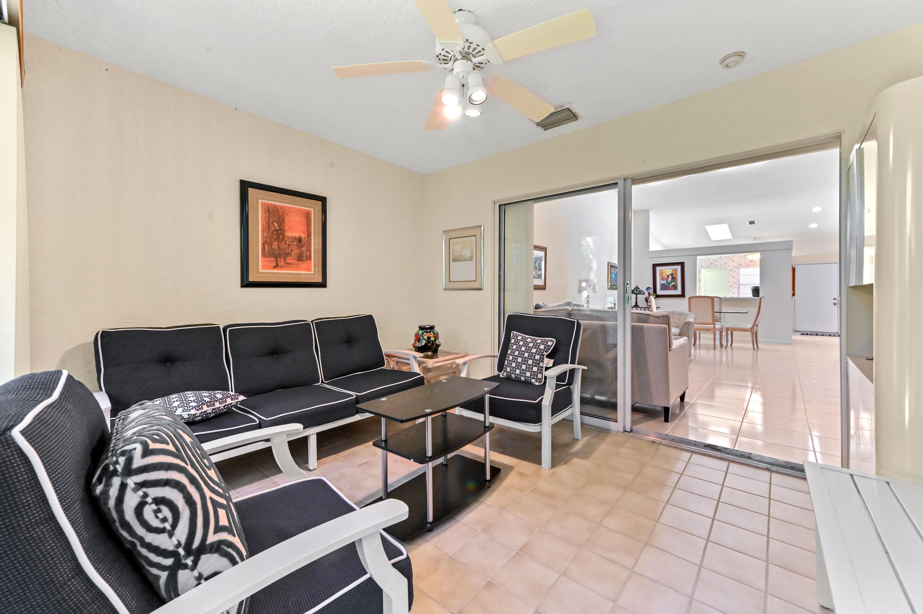 6040 Waldwick Circle Delray Beach, FL 33484 - Photo 25 of 75 a living room with furniture a dining table and chairs with kitchen view