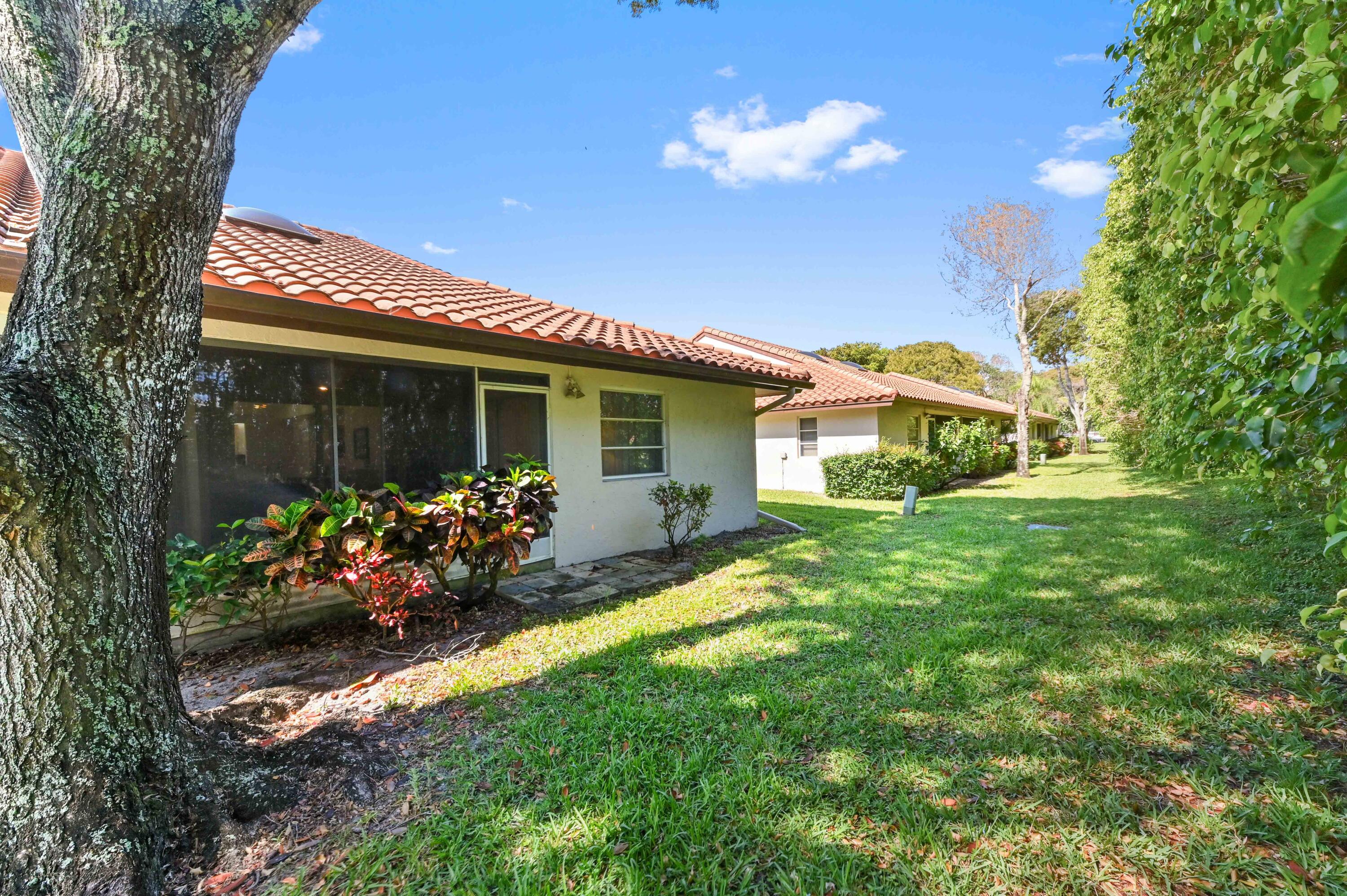 6040 Waldwick Circle Delray Beach, FL 33484 - Photo 26 of 75 a front view of a house with a yard