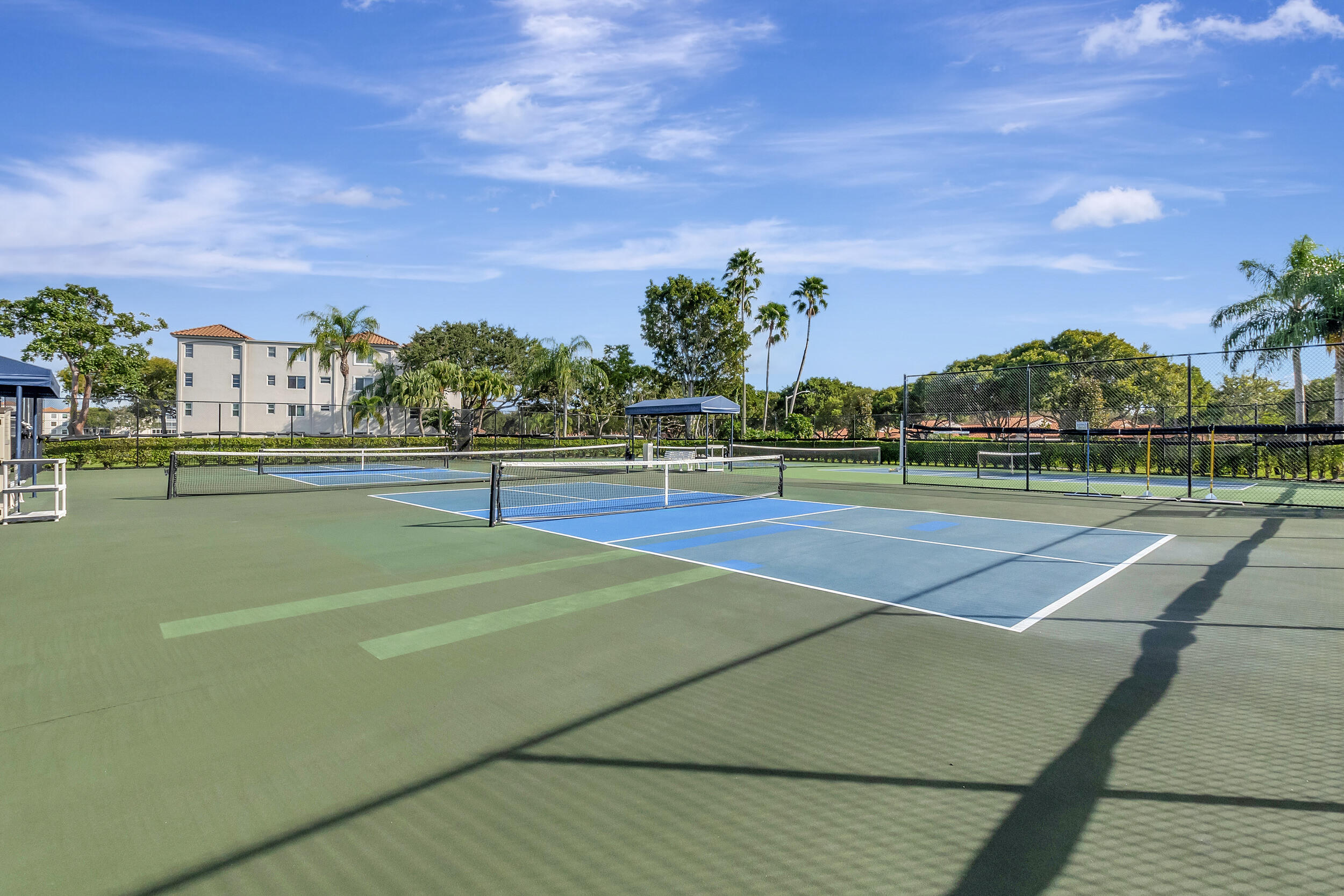 6040 Waldwick Circle Delray Beach, FL 33484 - Photo 72 of 75 a view of an outdoor space and tennis court