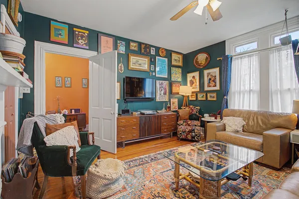 a living room with furniture fireplace and flat screen tv