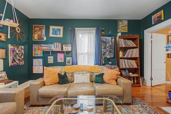 a living room with furniture and a window