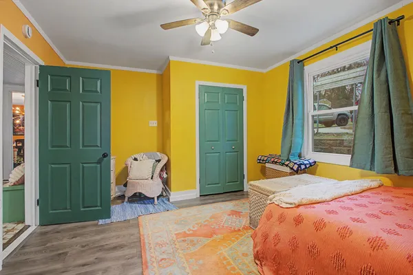 a bedroom with a bed and a table in it