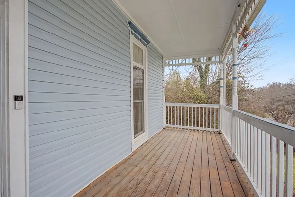 a view of backyard with a deck