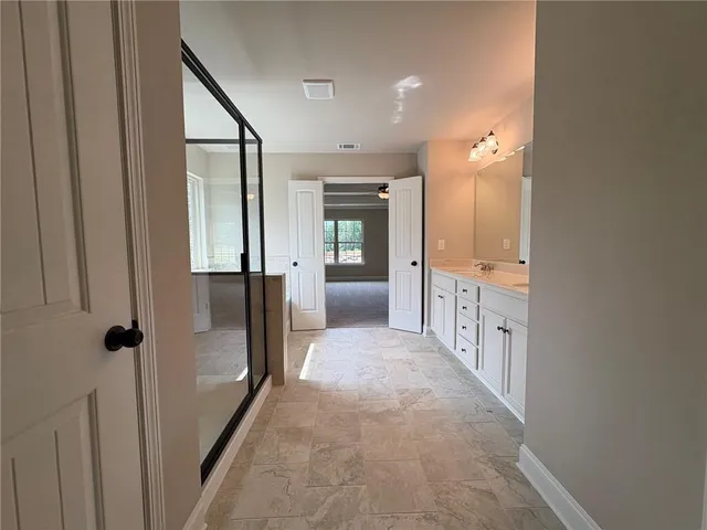 a view of a hallway view with wooden floor and staircase