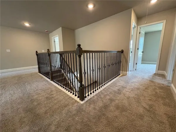 a view of a hallway with windows