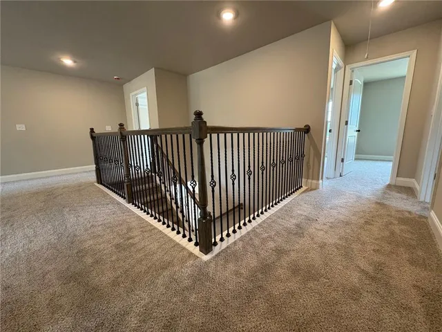 a view of a hallway with windows