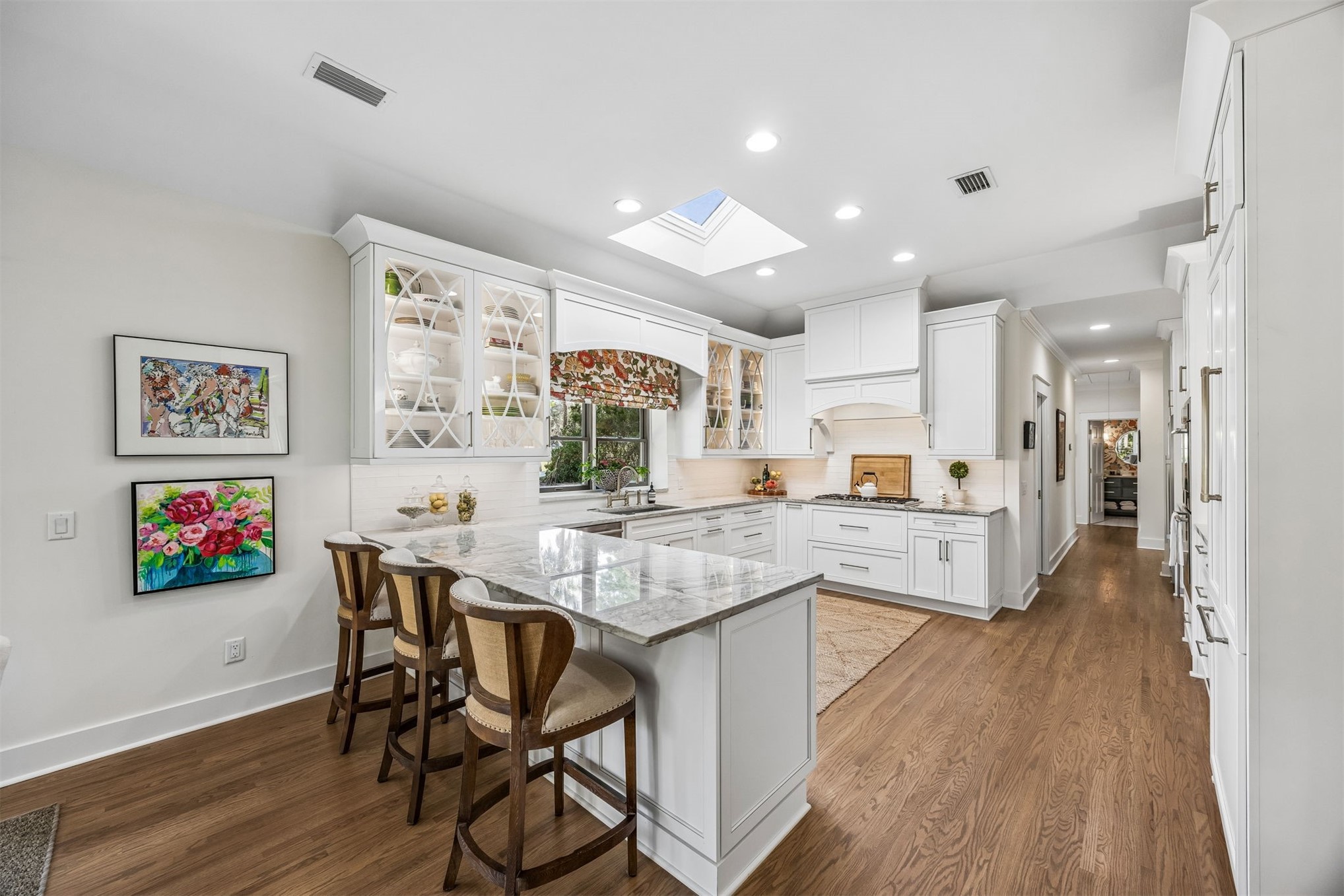 11 Red Maple Road Fernandina Beach, FL 32034 - Photo 13 of 70 a kitchen with stainless steel appliances granite countertop wooden floors and white cabinets
