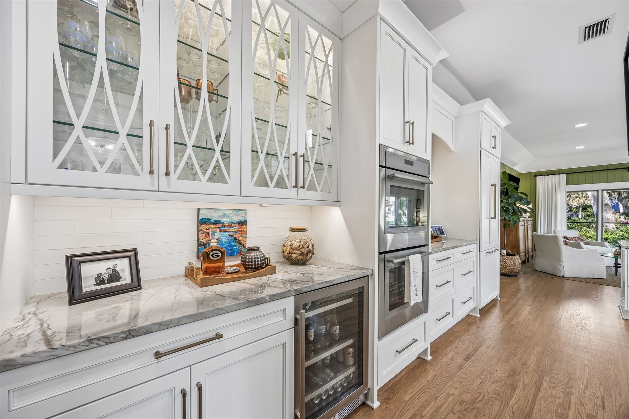 11 Red Maple Road Fernandina Beach, FL 32034 - Photo 16 of 70 a kitchen with stainless steel appliances white cabinets and wooden floor
