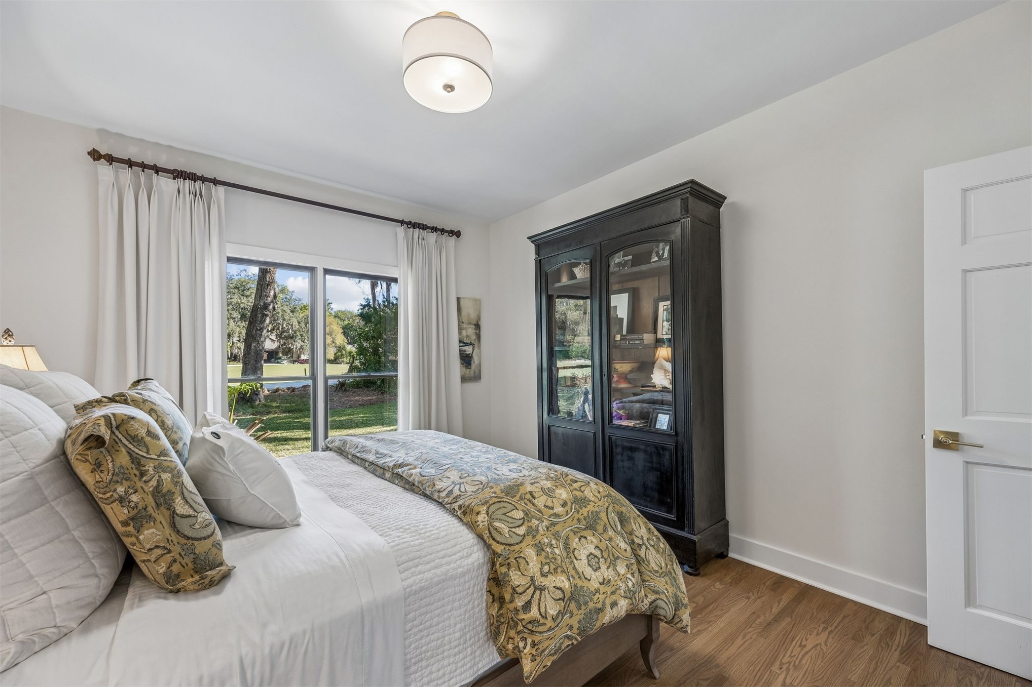 11 Red Maple Road Fernandina Beach, FL 32034 - Photo 27 of 70 a bedroom with a large bed and a large window