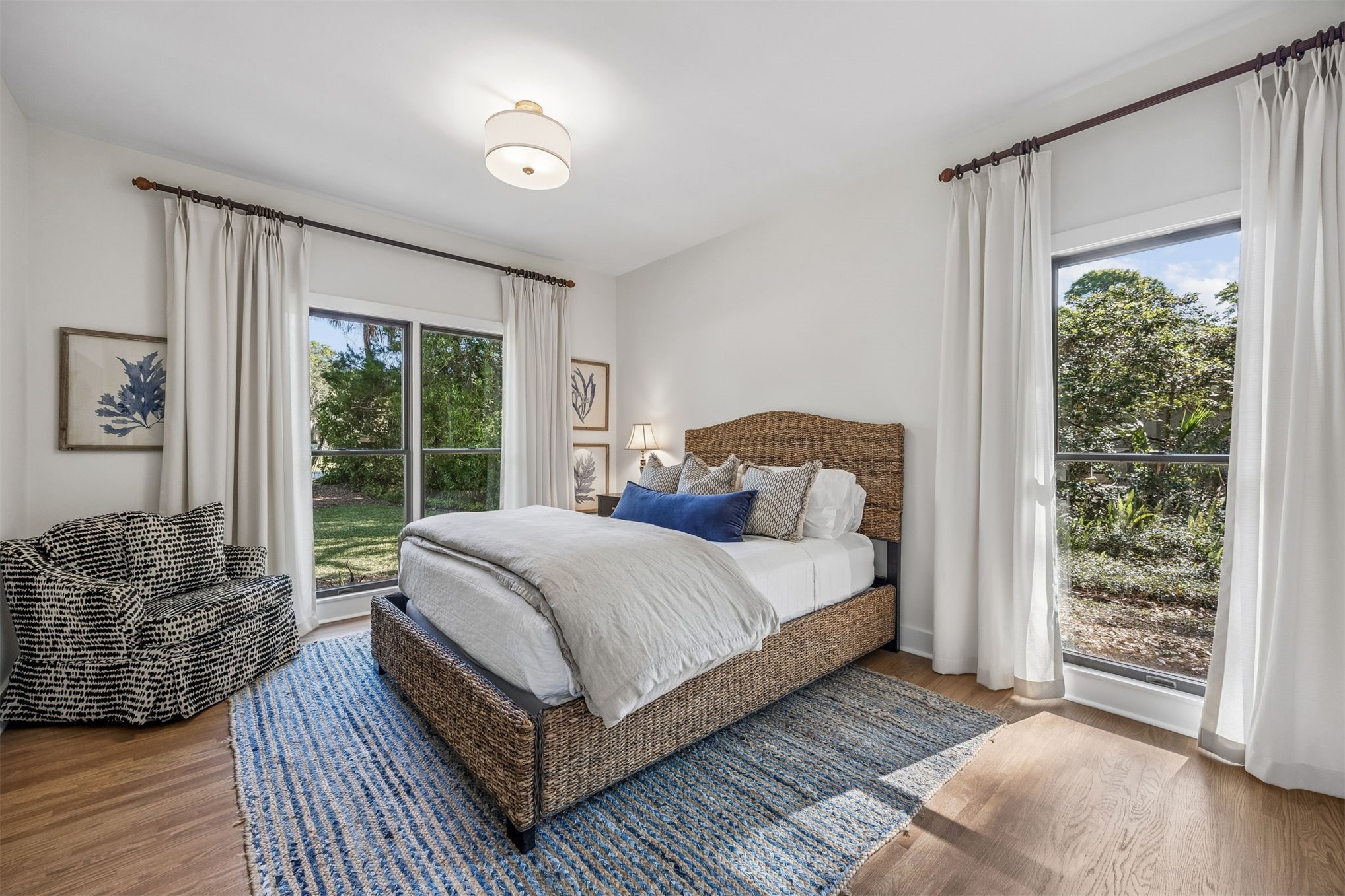 11 Red Maple Road Fernandina Beach, FL 32034 - Photo 30 of 70 a bedroom with a bed lamp and large window