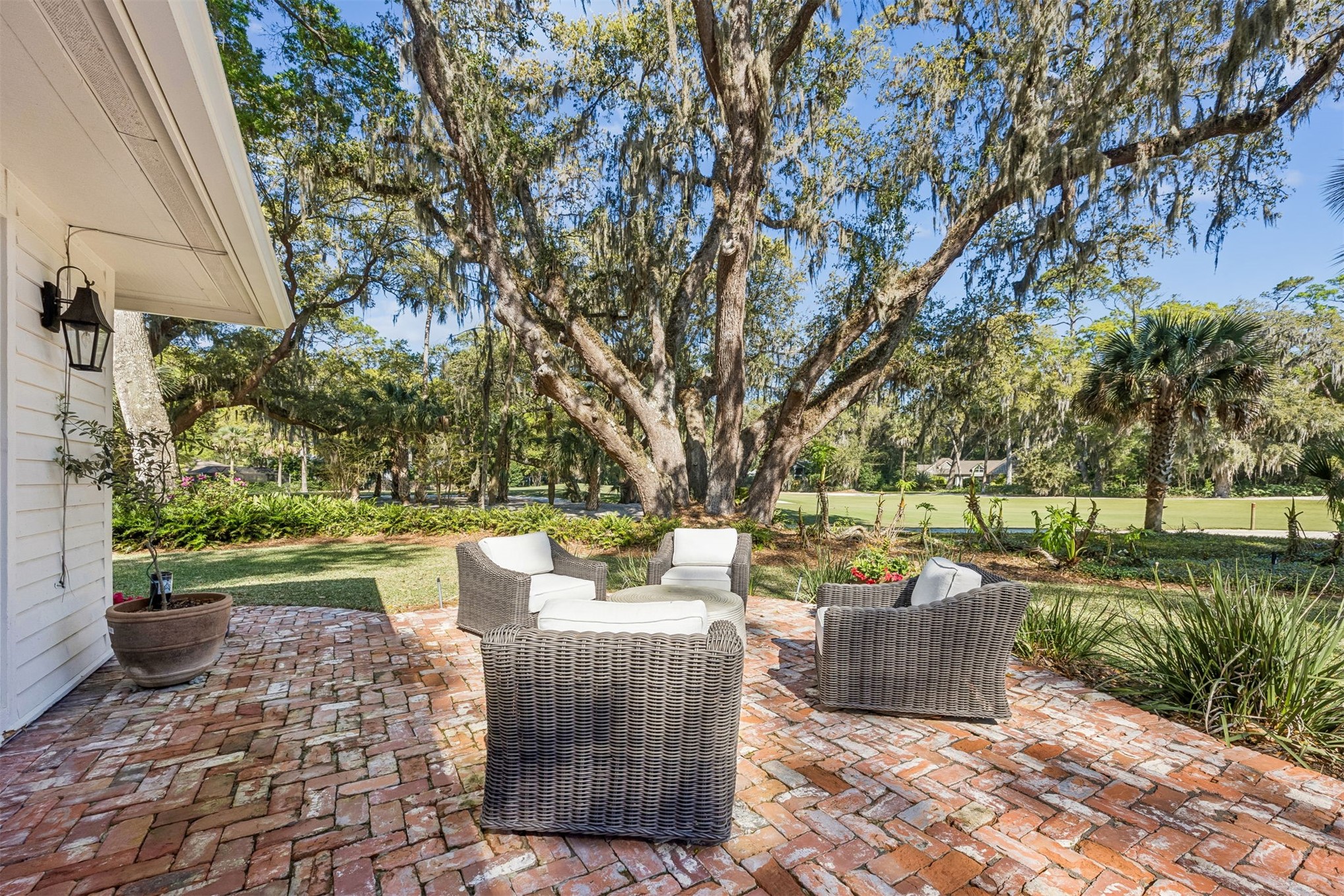 11 Red Maple Road Fernandina Beach, FL 32034 - Photo 35 of 70 a patio with table and chairs and potted plants