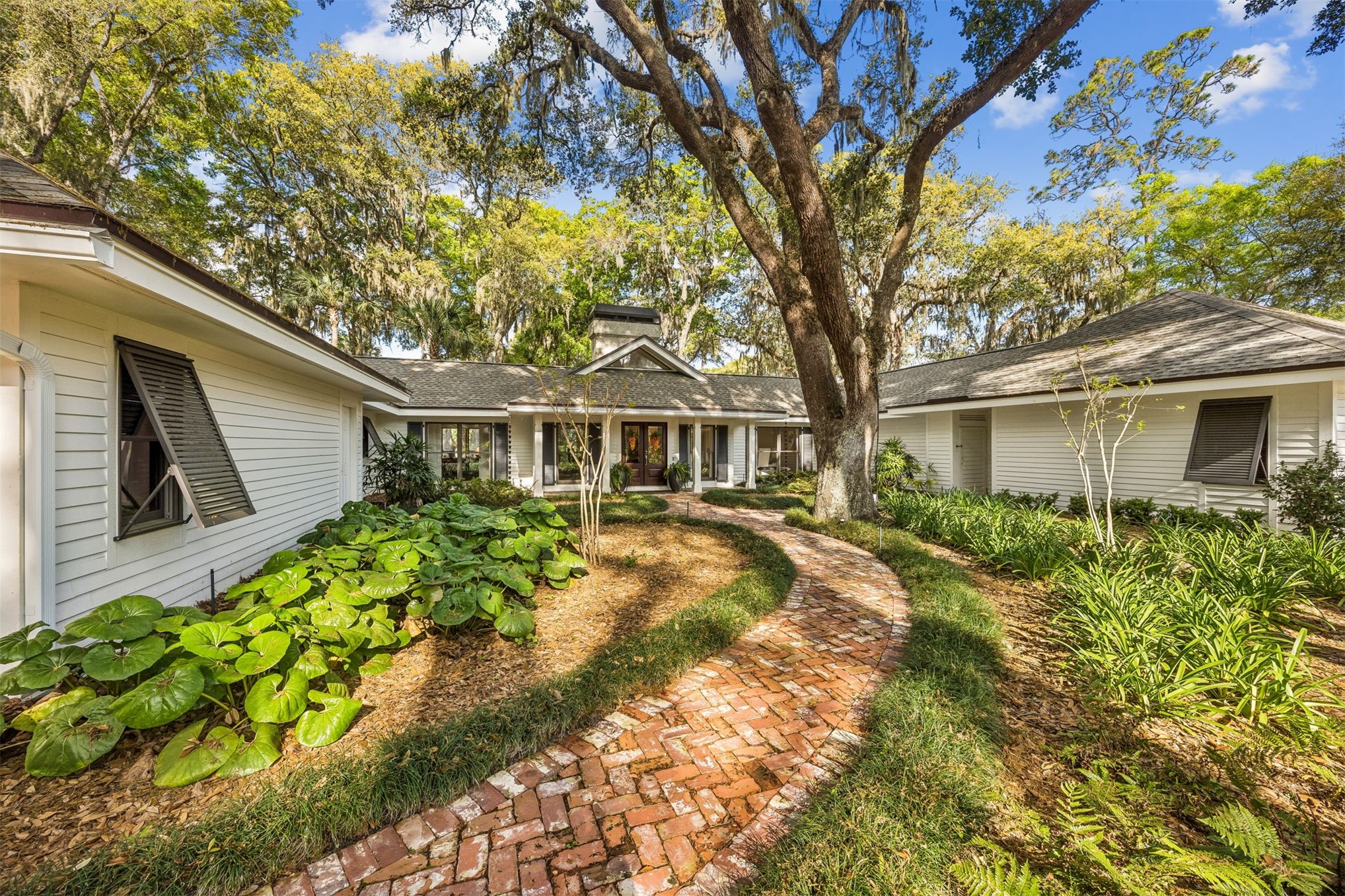 11 Red Maple Road Fernandina Beach, FL 32034 - Photo 4 of 70 a front view of a house with a yard