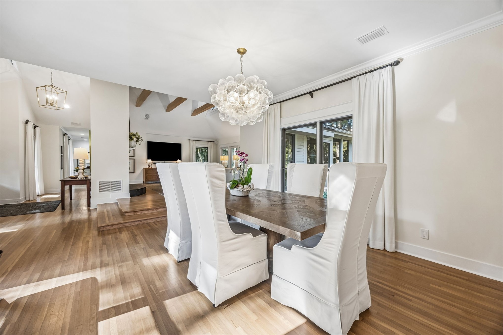 11 Red Maple Road Fernandina Beach, FL 32034 - Photo 10 of 70 a living room with furniture a dining table and a chandelier