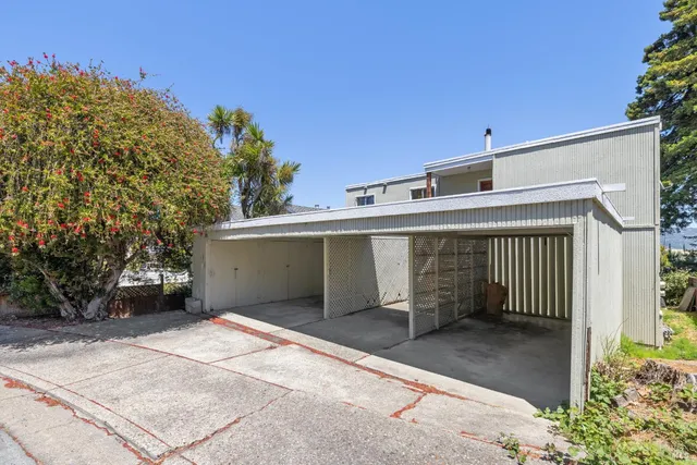 a front view of a house with a garage
