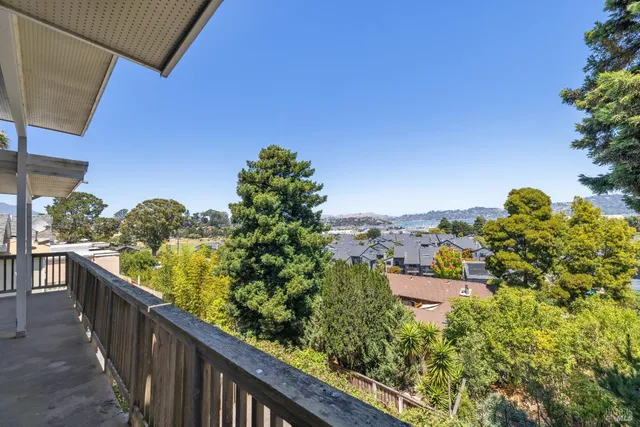 a balcony with outdoor space and garden view