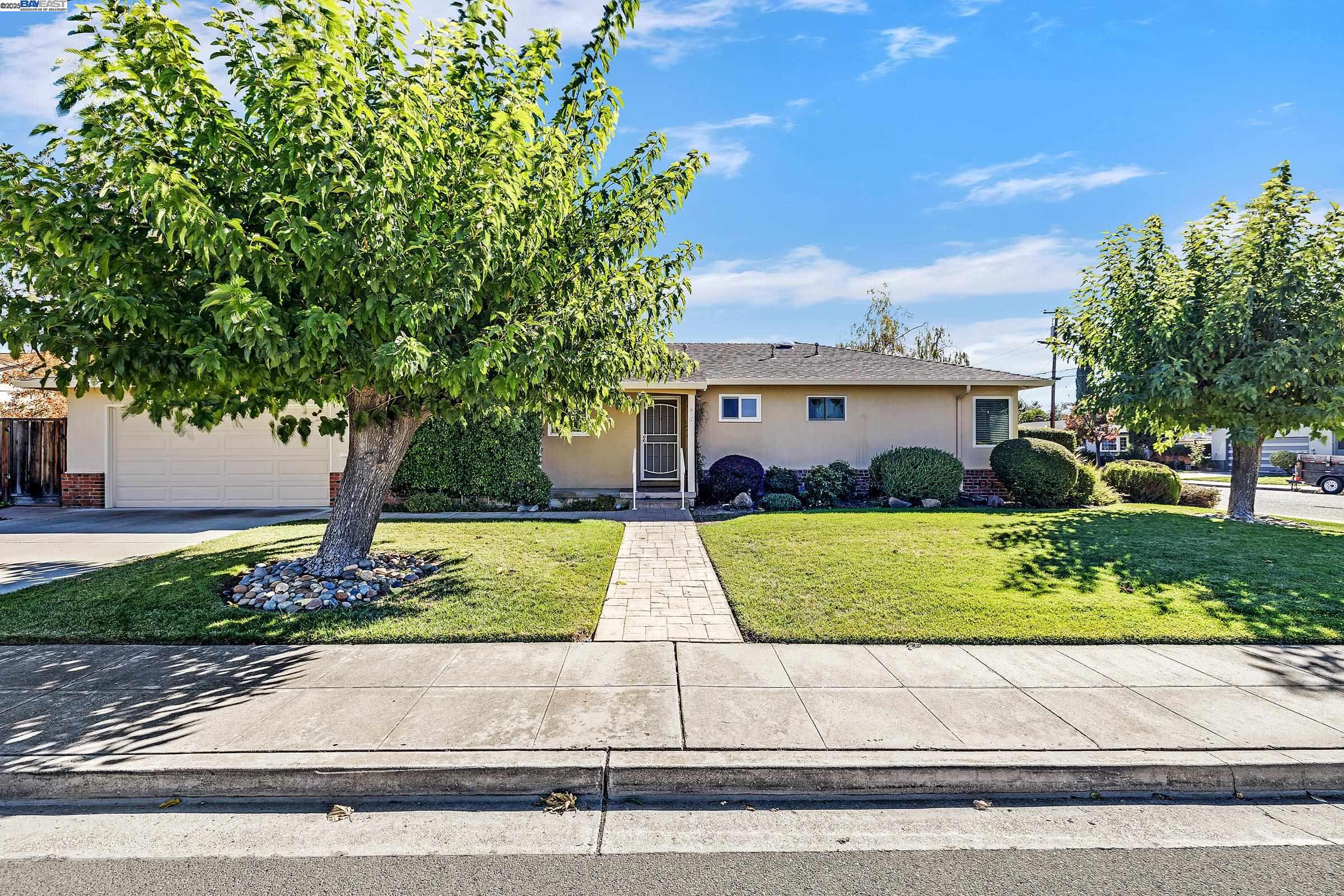 596 Tyler Avenue Livermore, CA 94550 - Photo 1 of 36 front view of a house with a yard