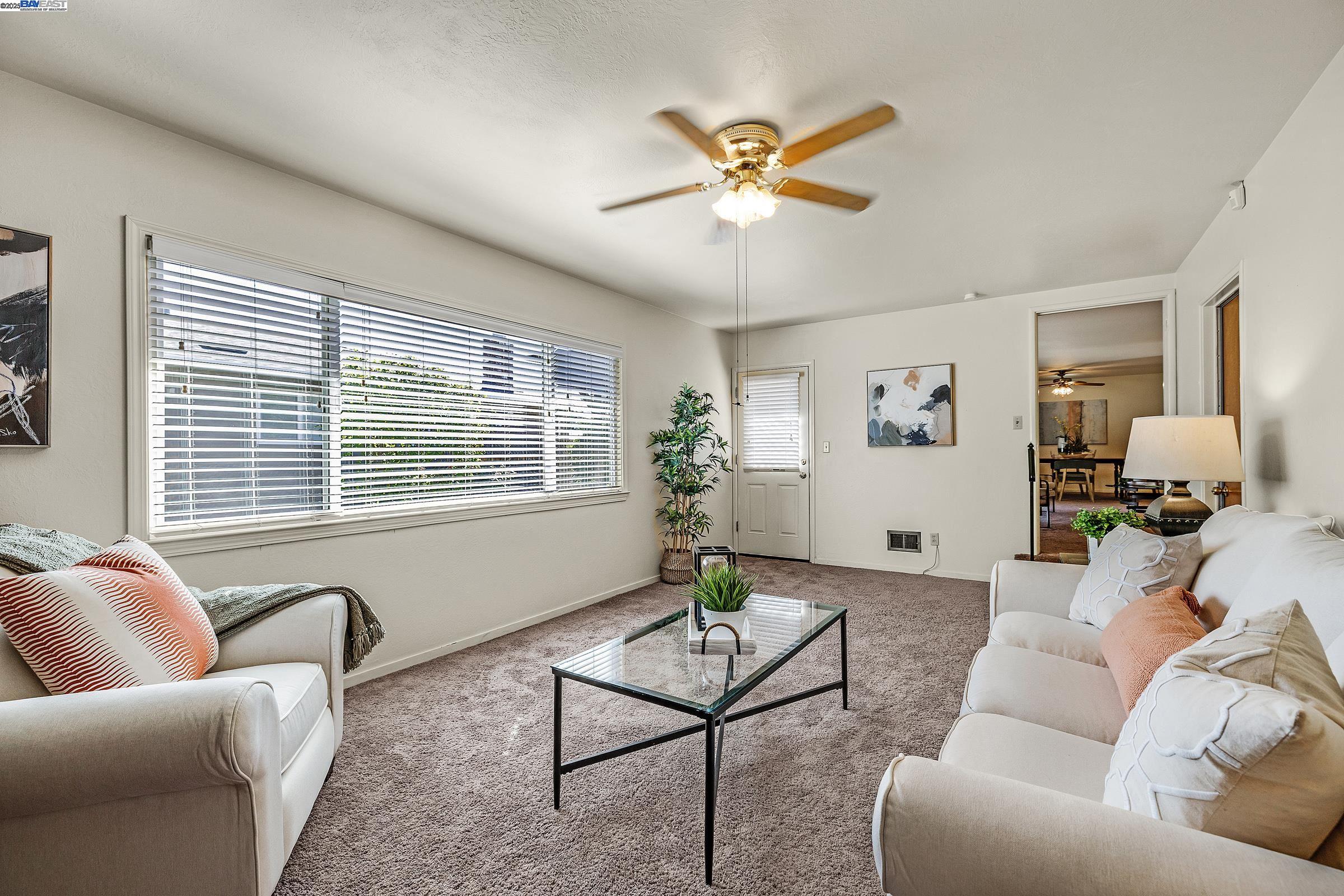 596 Tyler Avenue Livermore, CA 94550 - Photo 12 of 36 a living room with furniture and a window