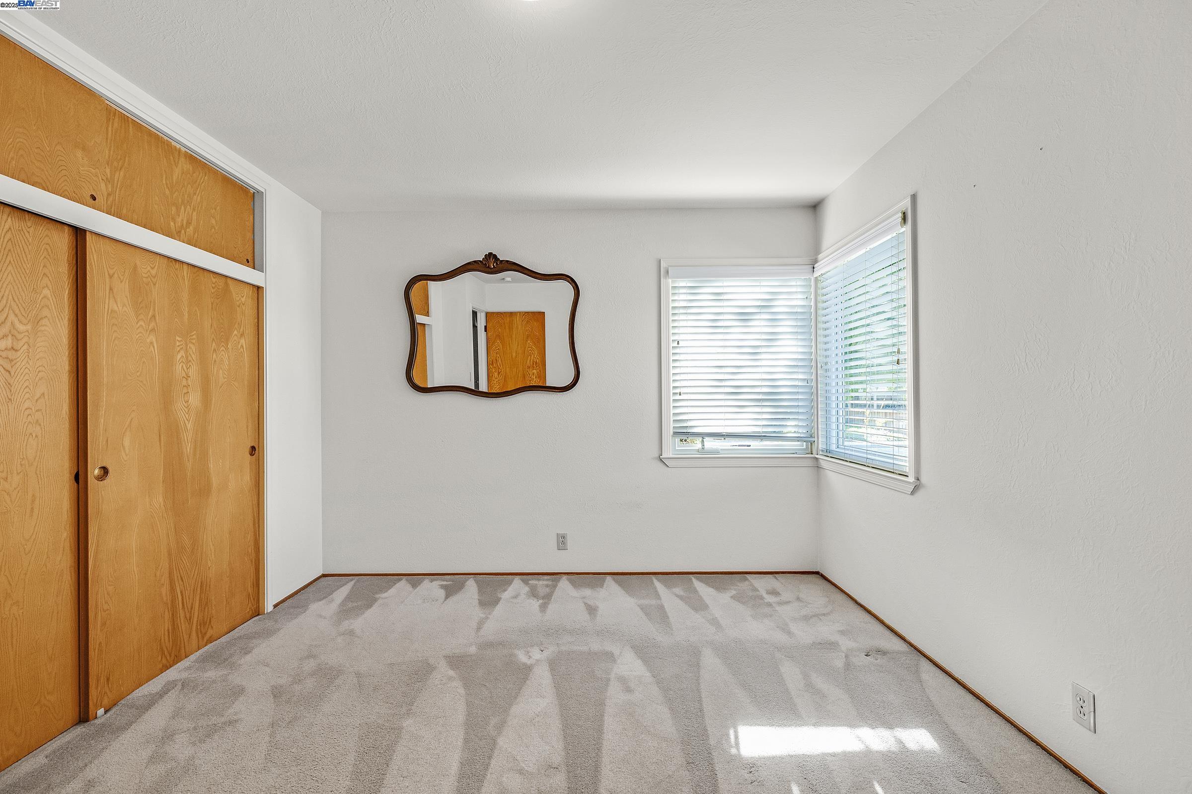 596 Tyler Avenue Livermore, CA 94550 - Photo 14 of 36 a view of an empty room with a window