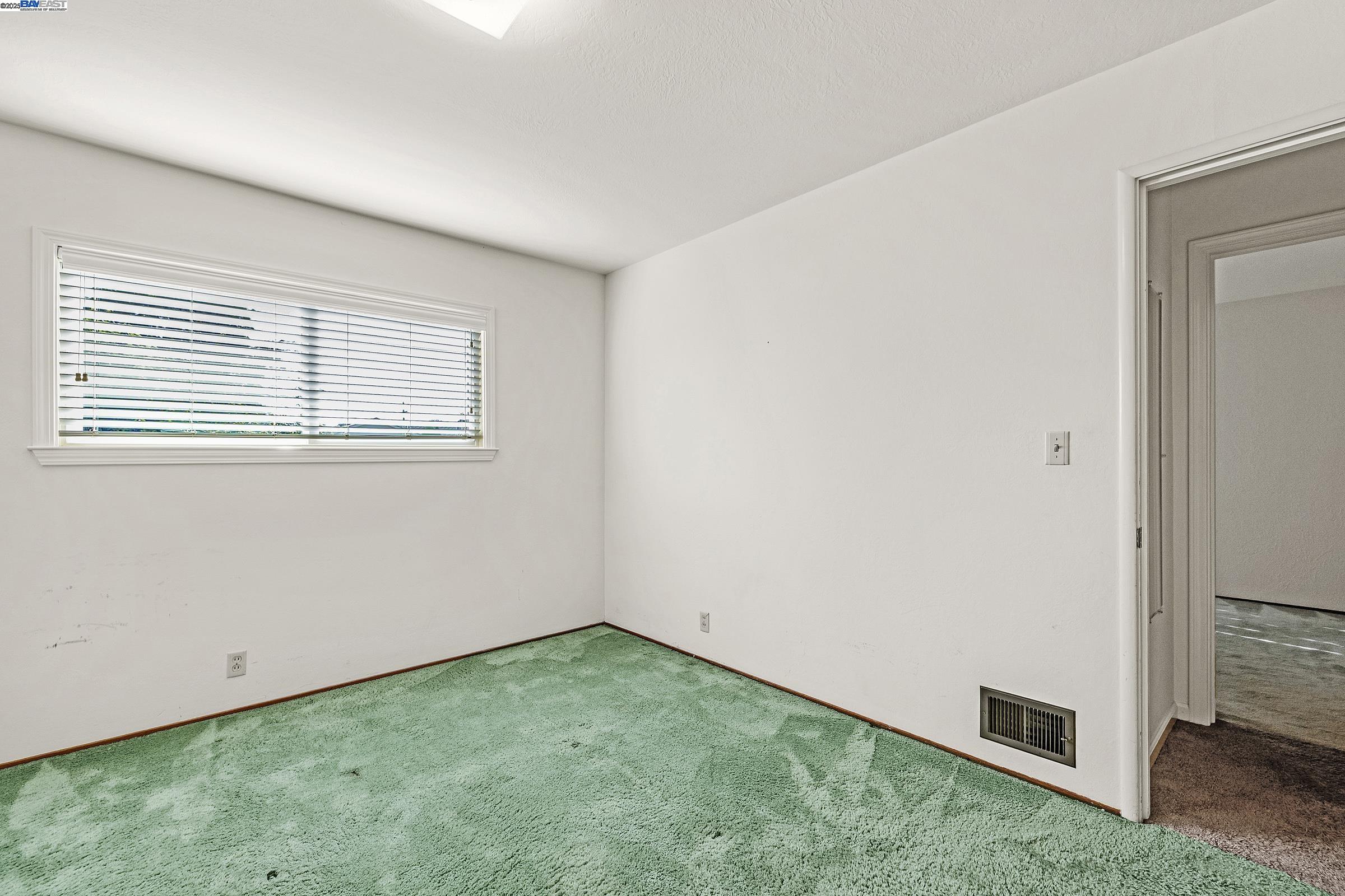 596 Tyler Avenue Livermore, CA 94550 - Photo 18 of 36 an empty room with a window