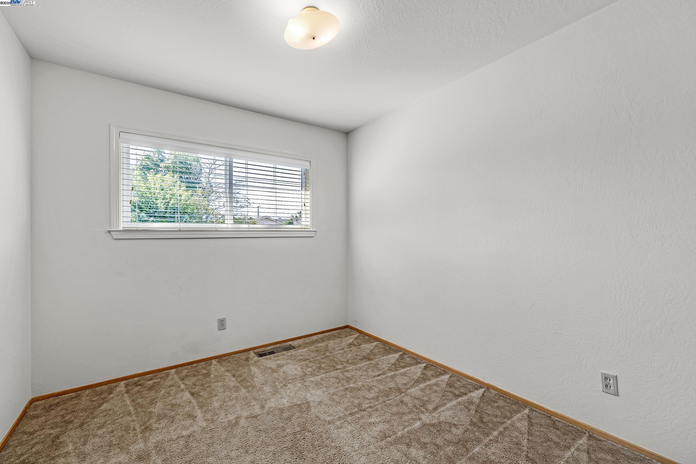596 Tyler Avenue Livermore, CA 94550 - Photo 19 of 36 an empty room with a window