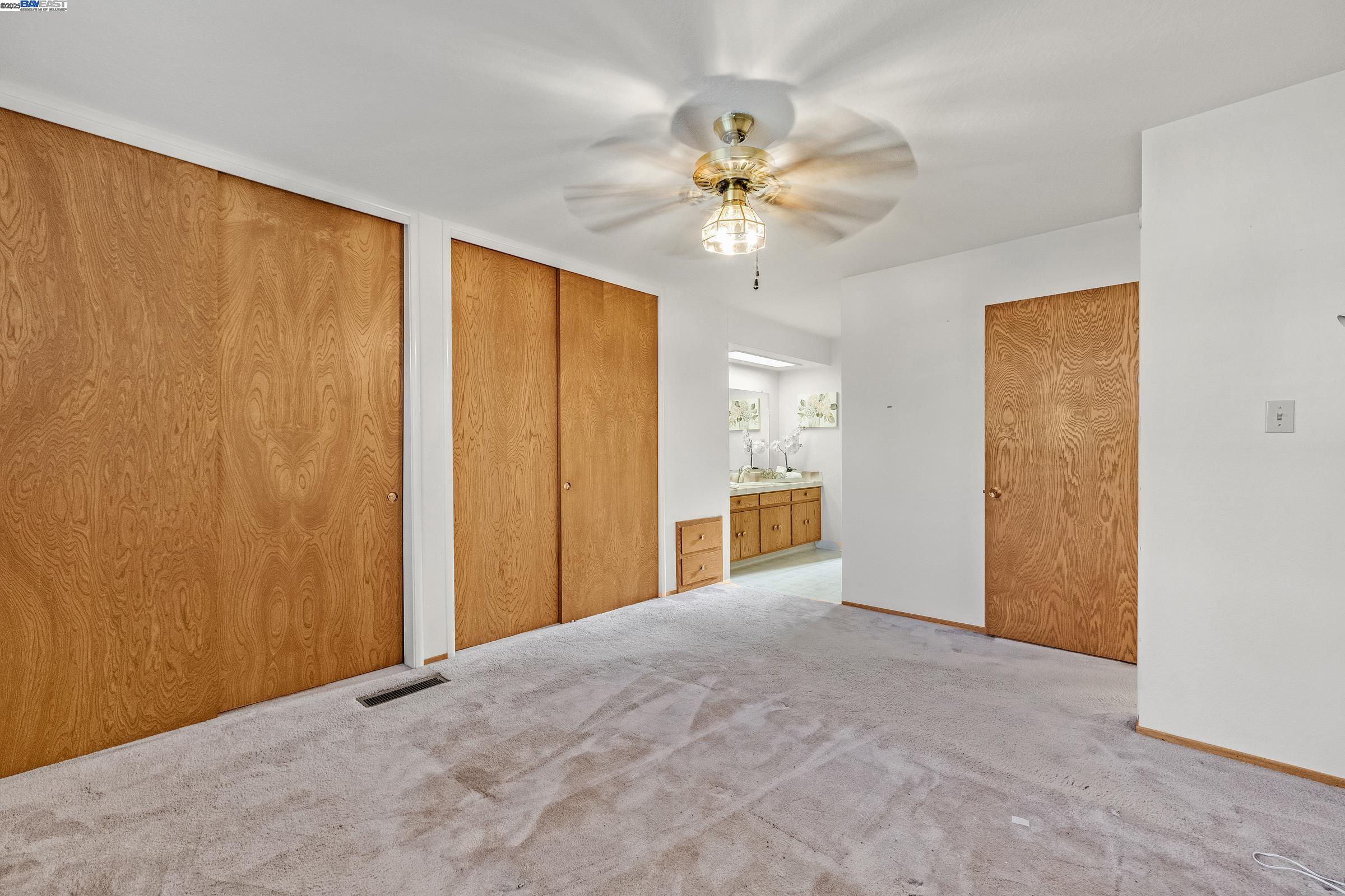 596 Tyler Avenue Livermore, CA 94550 - Photo 24 of 36 a view of a big room with wooden floor and closet area