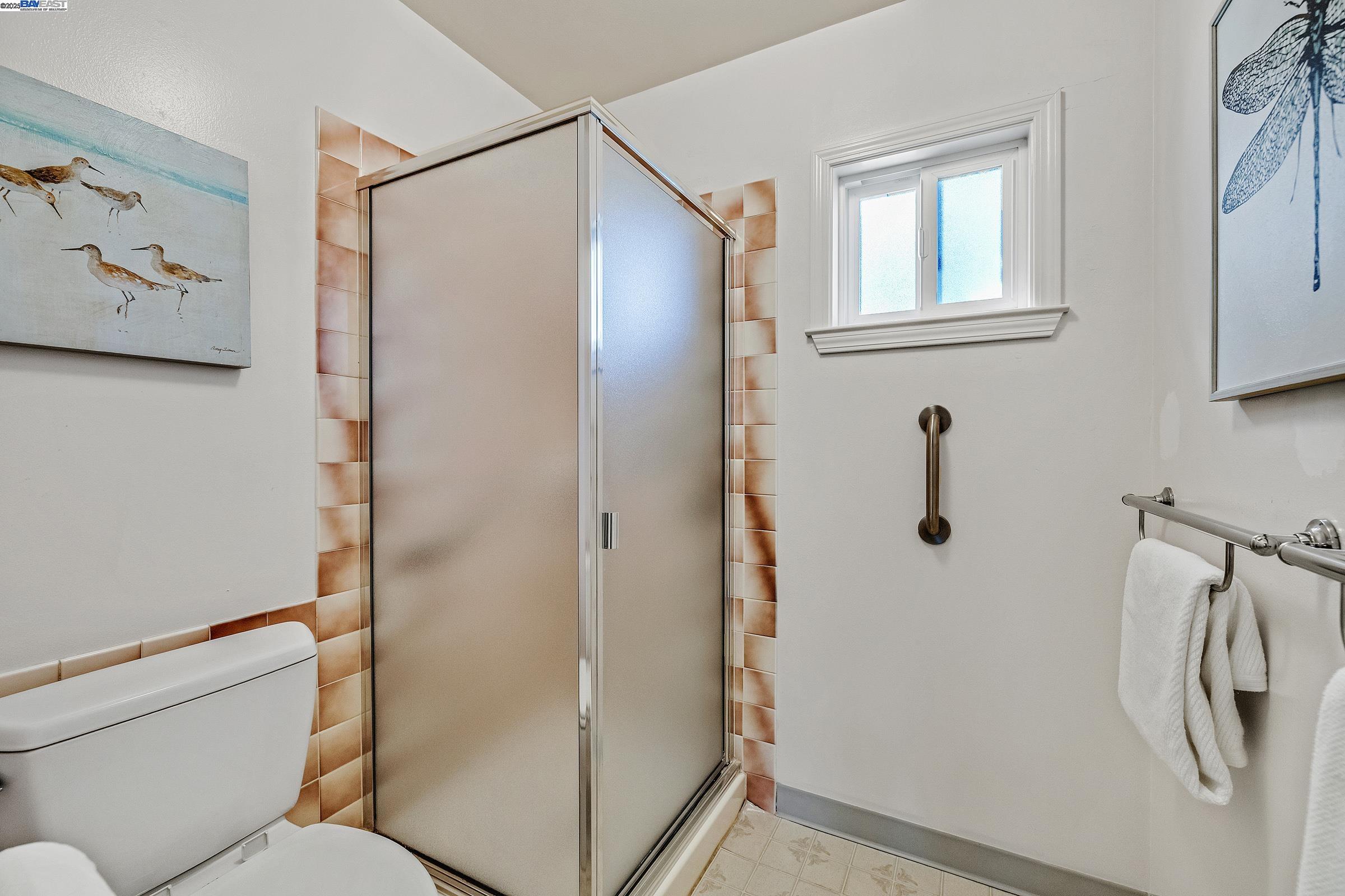 596 Tyler Avenue Livermore, CA 94550 - Photo 26 of 36 a bathroom with a shower and a toilet
