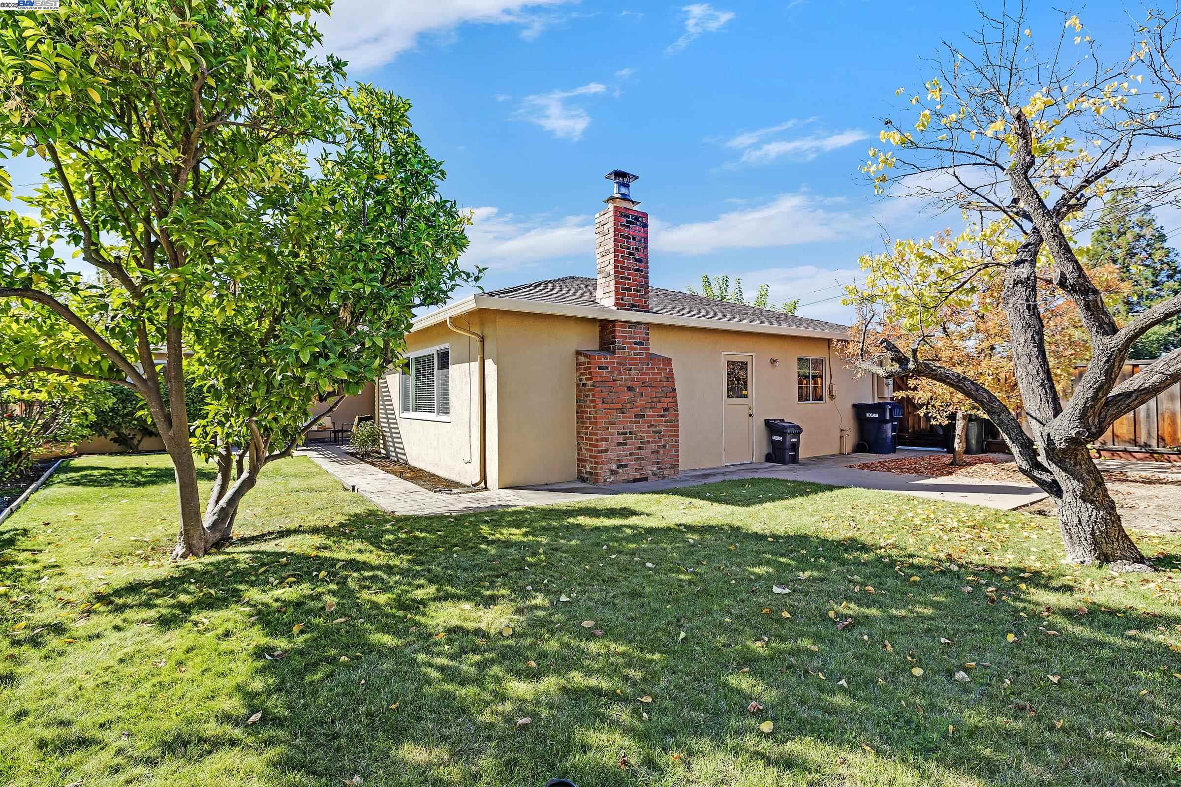 596 Tyler Avenue Livermore, CA 94550 - Photo 33 of 36 a front view of a house with a yard