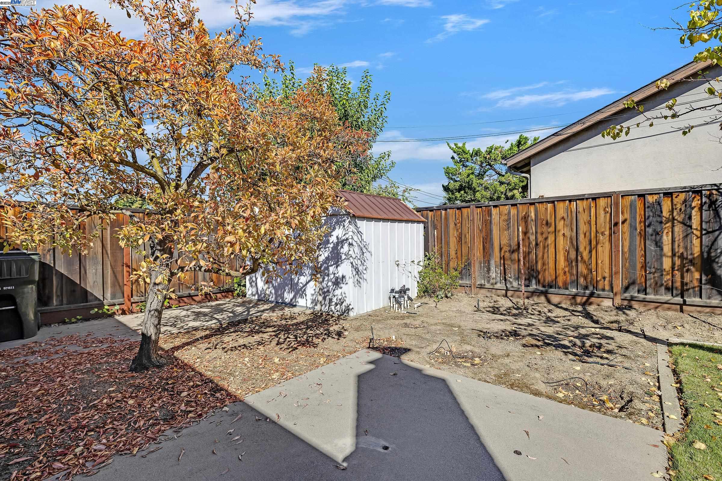 596 Tyler Avenue Livermore, CA 94550 - Photo 34 of 36 a view of a backyard with wooden fence