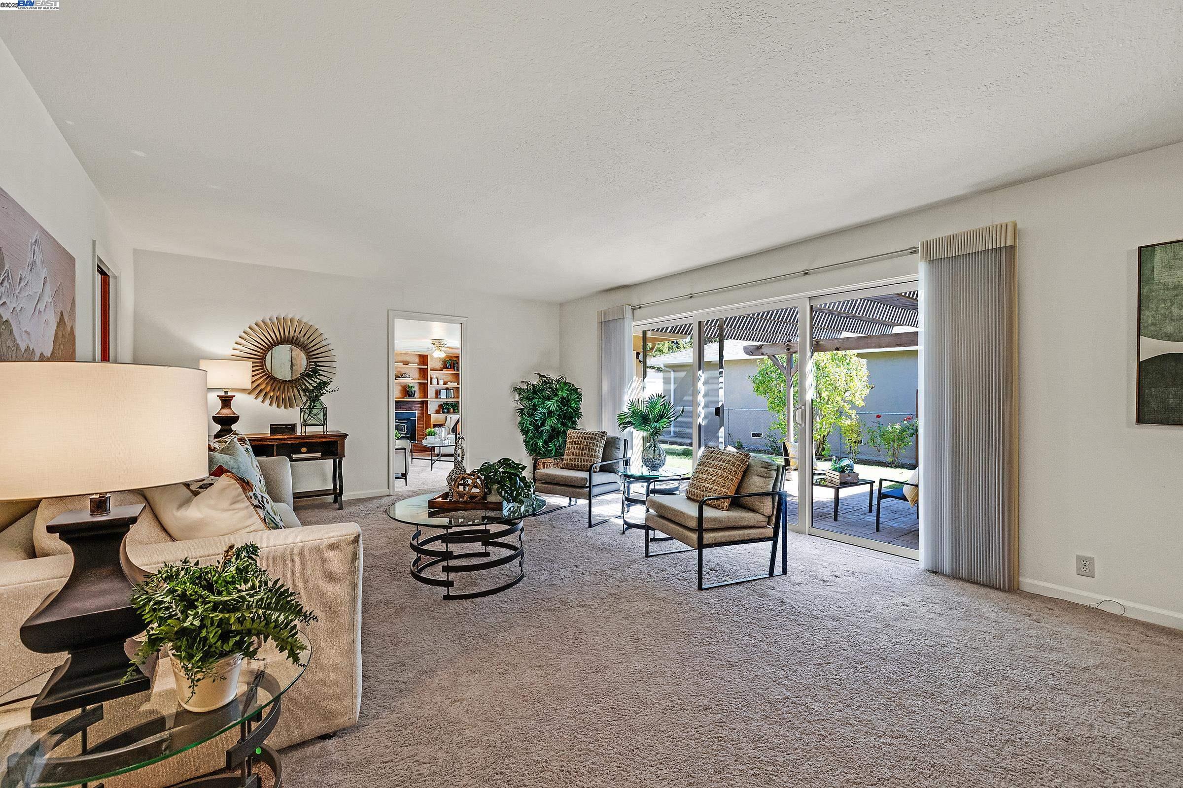 596 Tyler Avenue Livermore, CA 94550 - Photo 8 of 36 a living room with furniture and a large window