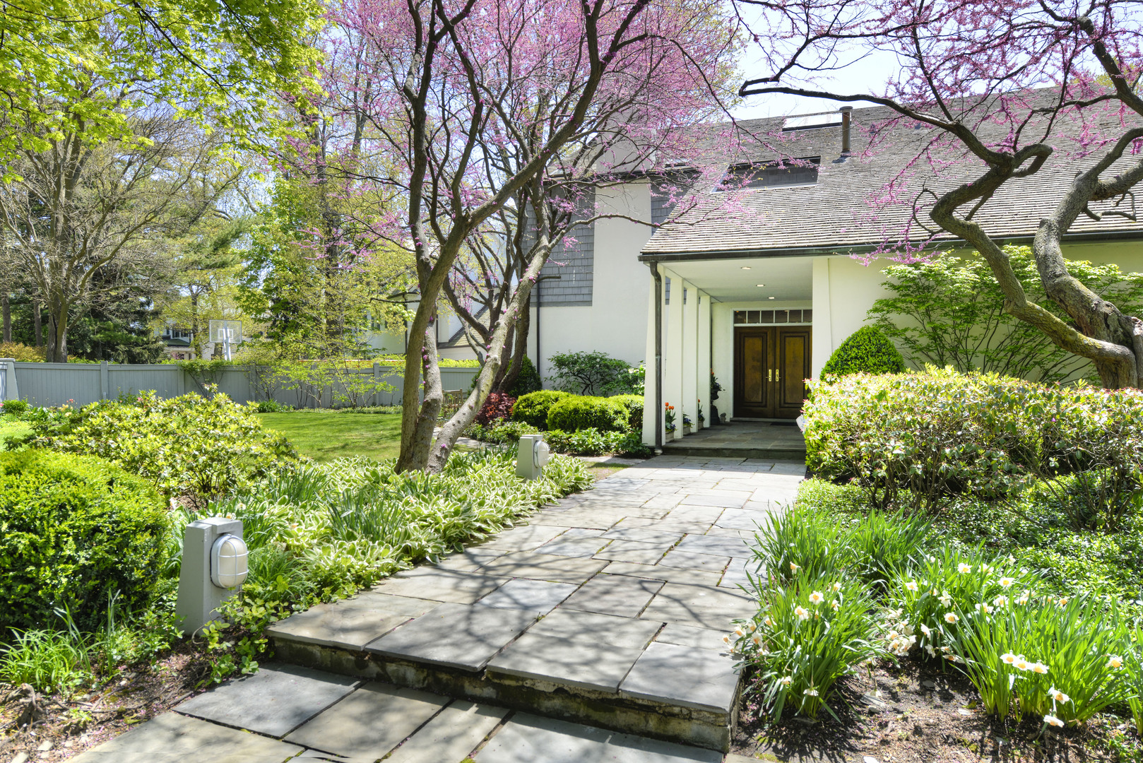 349 Sheridan Road Winnetka, IL 60093 - Photo 17 of 65 a front view of a house with garden