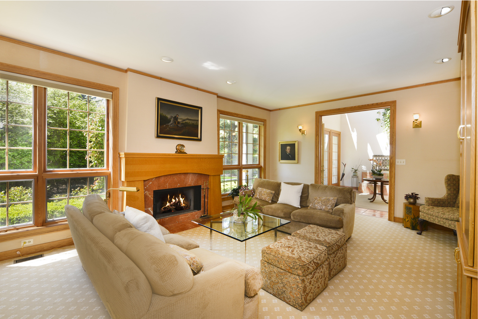 349 Sheridan Road Winnetka, IL 60093 - Photo 23 of 65 a living room with furniture a fireplace and floor to ceiling windows
