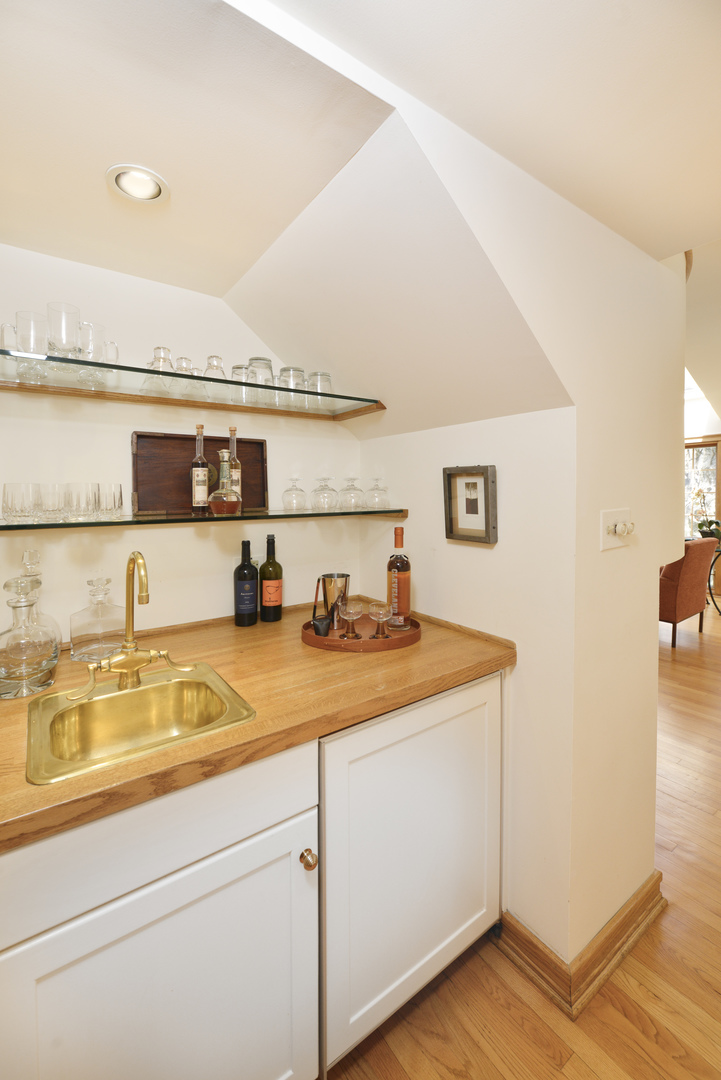349 Sheridan Road Winnetka, IL 60093 - Photo 31 of 65 a view of a kitchen with a sink and wooden floor