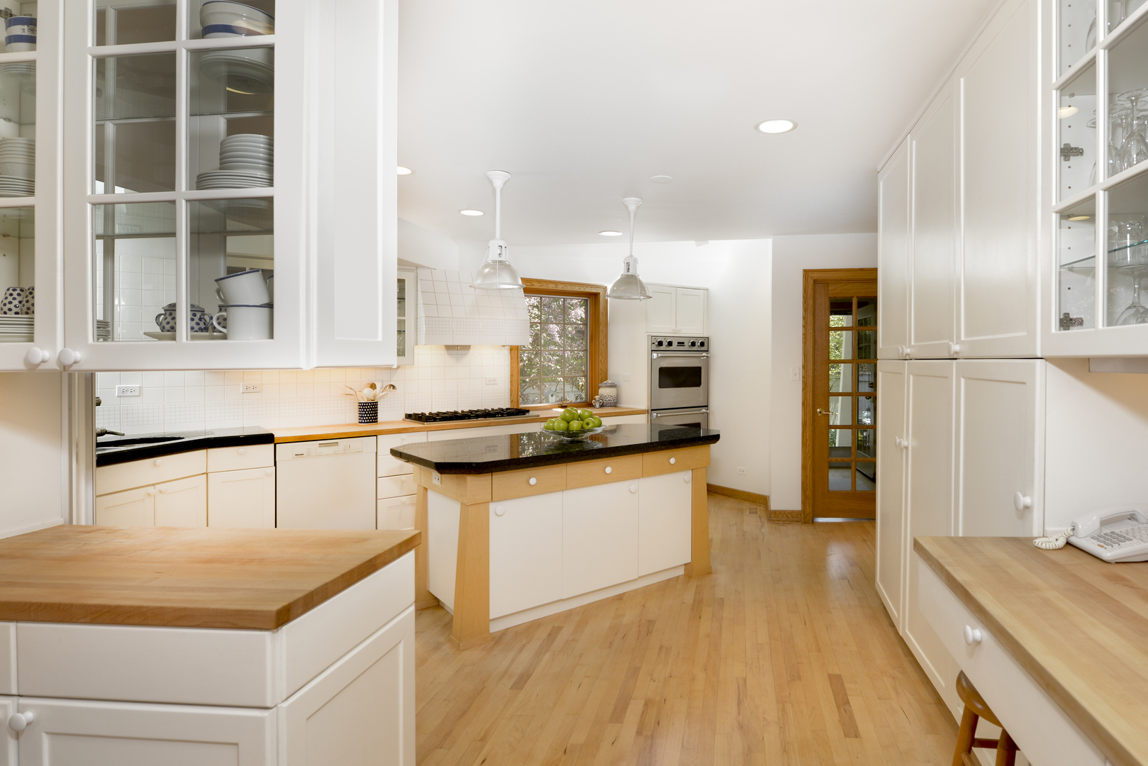 349 Sheridan Road Winnetka, IL 60093 - Photo 41 of 65 a kitchen with stainless steel appliances granite countertop a sink and a refrigerator