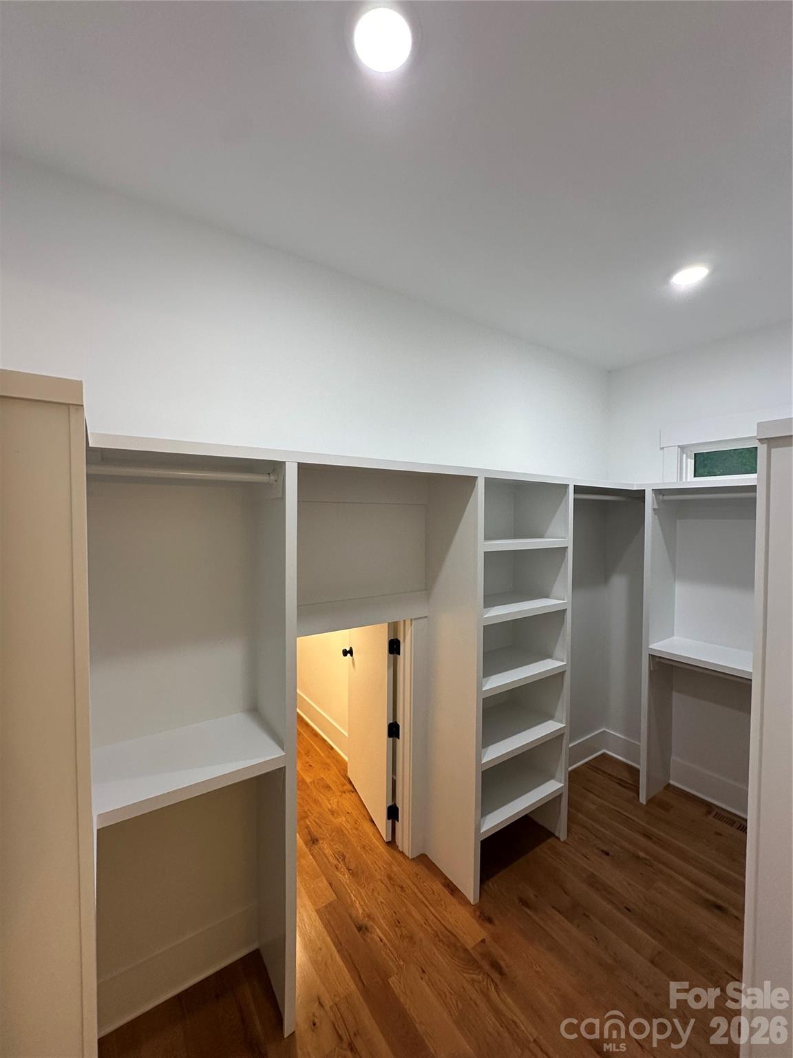 0 White Oaks Road, Unit 1 Mooresville, NC 28115 - Photo 15 of 27 a view of walk in closet with empty racks
