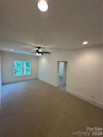 a view of an empty room with a bathroom