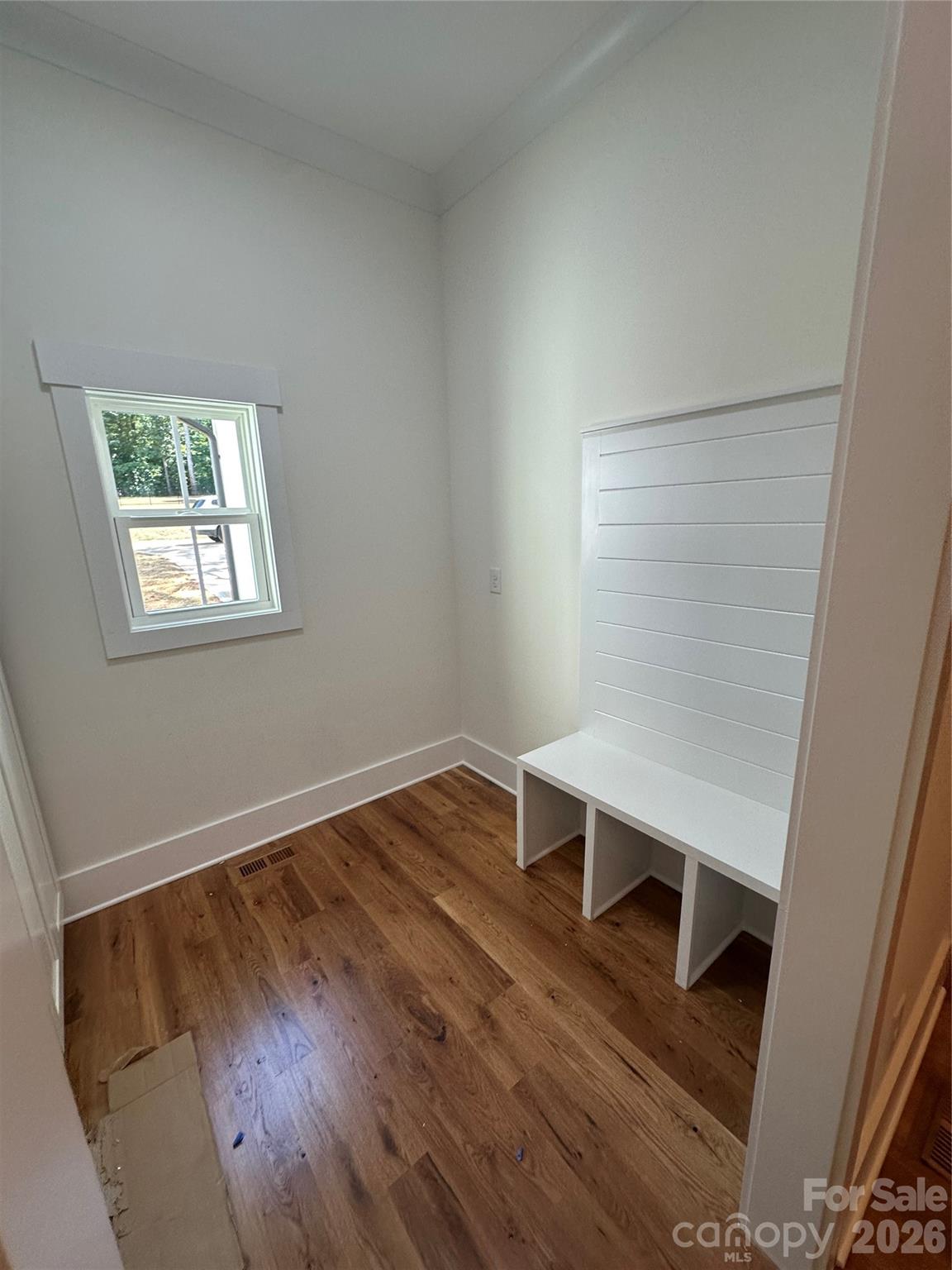 0 White Oaks Road, Unit 1 Mooresville, NC 28115 - Photo 25 of 27 an empty room with wooden floor and windows