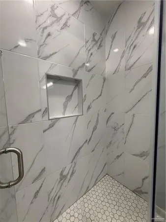 a bathroom with a sink and a shower