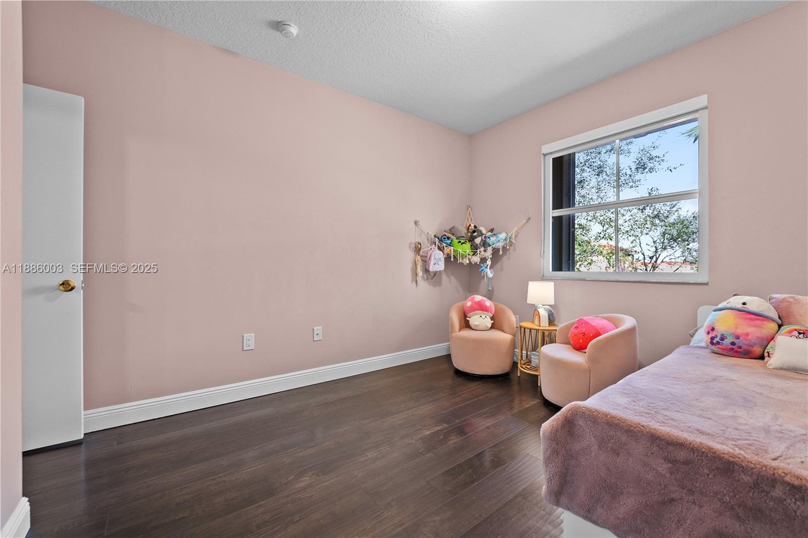 3070 Southwest 153rd Path Miami, FL 33185 - Photo 28 of 41 a room with wooden floor and windows