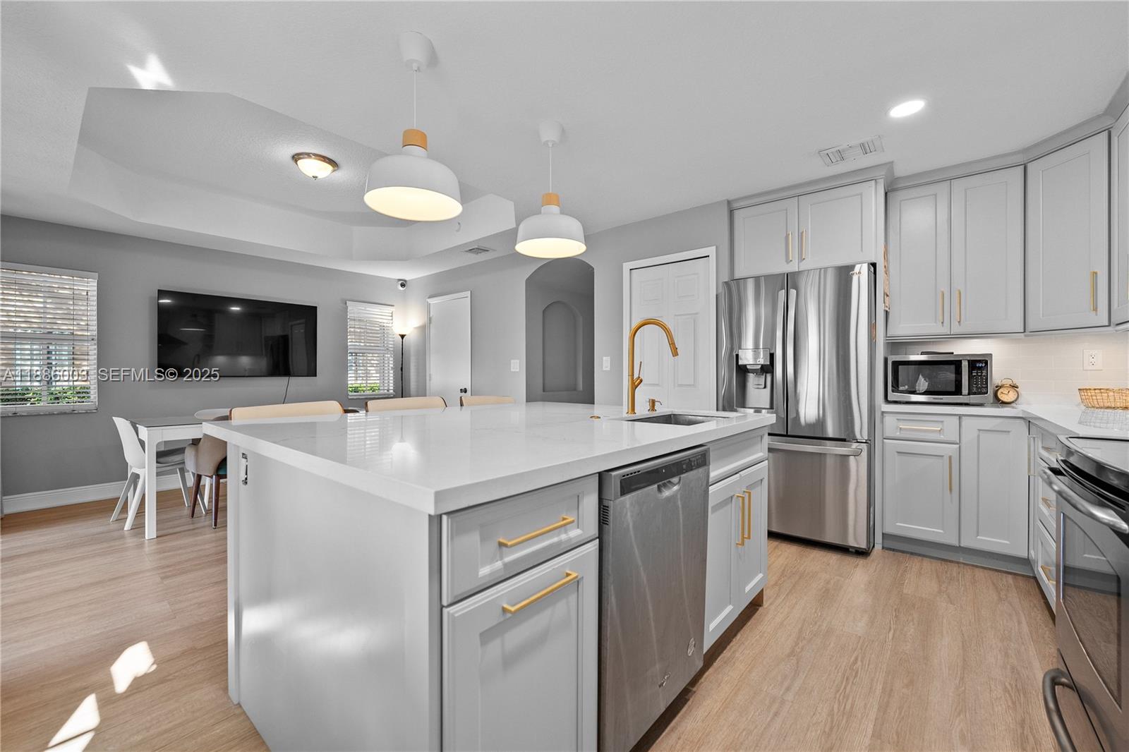 3070 Southwest 153rd Path Miami, FL 33185 - Photo 7 of 41 a kitchen with a sink a counter top space stainless steel appliances and cabinets