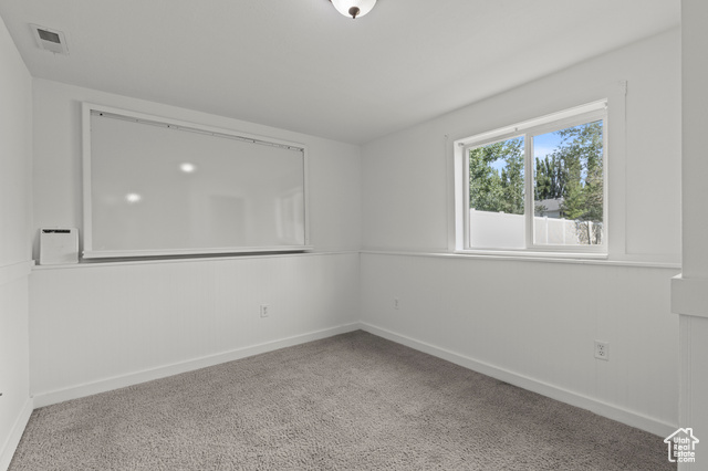1099 Three Point Avenue Logan, UT 84321 - Photo 20 of 27 Unfurnished room featuring baseboards and carpet flooring
