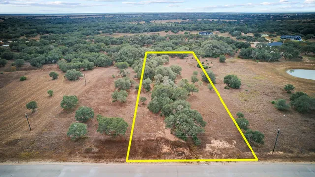 a view of a swimming pool with a yard