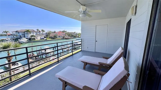 a view of a balcony with furniture