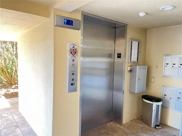 a view of walk in closet with white walls