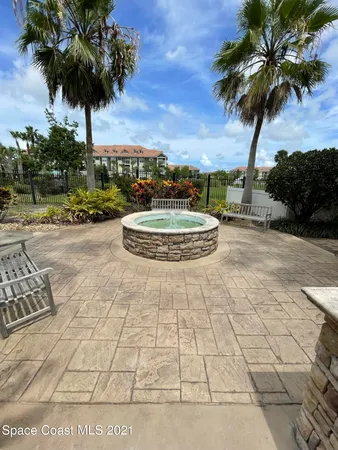 a view of a porch with furniture and a fireplace