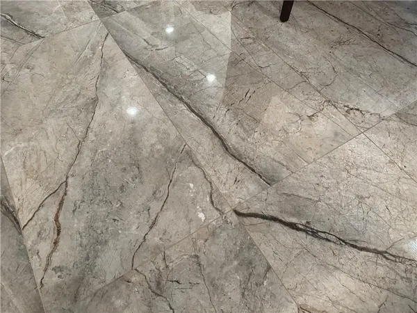 a kitchen with a sink cabinets and chairs
