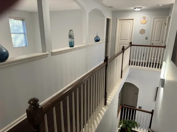 a bedroom with a bed and a table in it