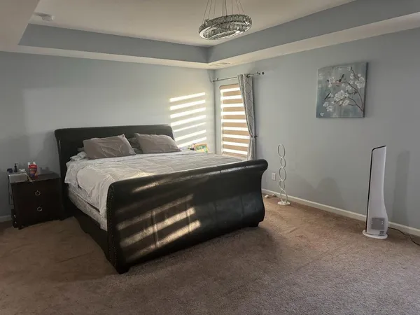a bathroom with a shower and a glass door