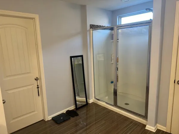 a bathroom with a double vanity sink and a mirror