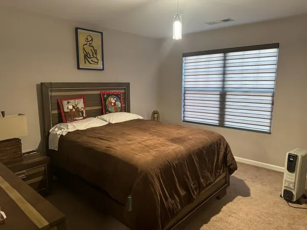 a view of brick house with a large windows