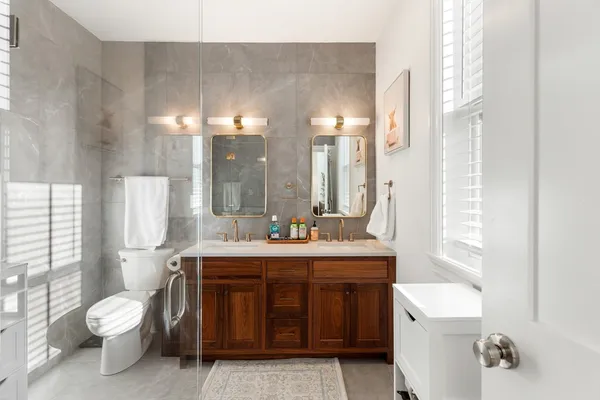 a bathroom with a sink a toilet and tub
